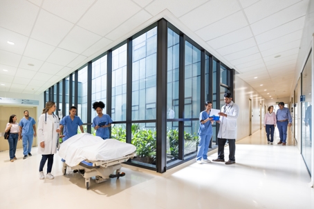 Patients and doctors walking in the corridor of a hospital
